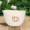 Burn & Bliss Soy Wax Massage Oil Candle - Soothing Lotus outdoors
